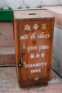 A charity box with chinese writing on it